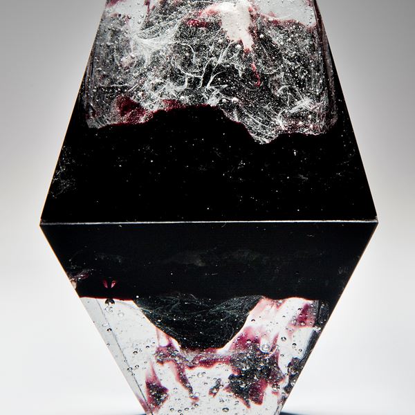 diamond shaped art-glass sculpture with plaster insert resembling frozen form in black crystal red 