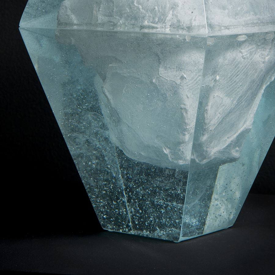 art glass sculpture of ice block frozen inside diamond shaped glass capsule