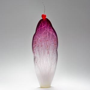 tall and thin decorative glass ornament in white and pink with natural looking internal structure and cherry on top