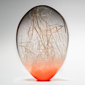 hand blown glass orb withgold wire internal structure and salmon coloured base