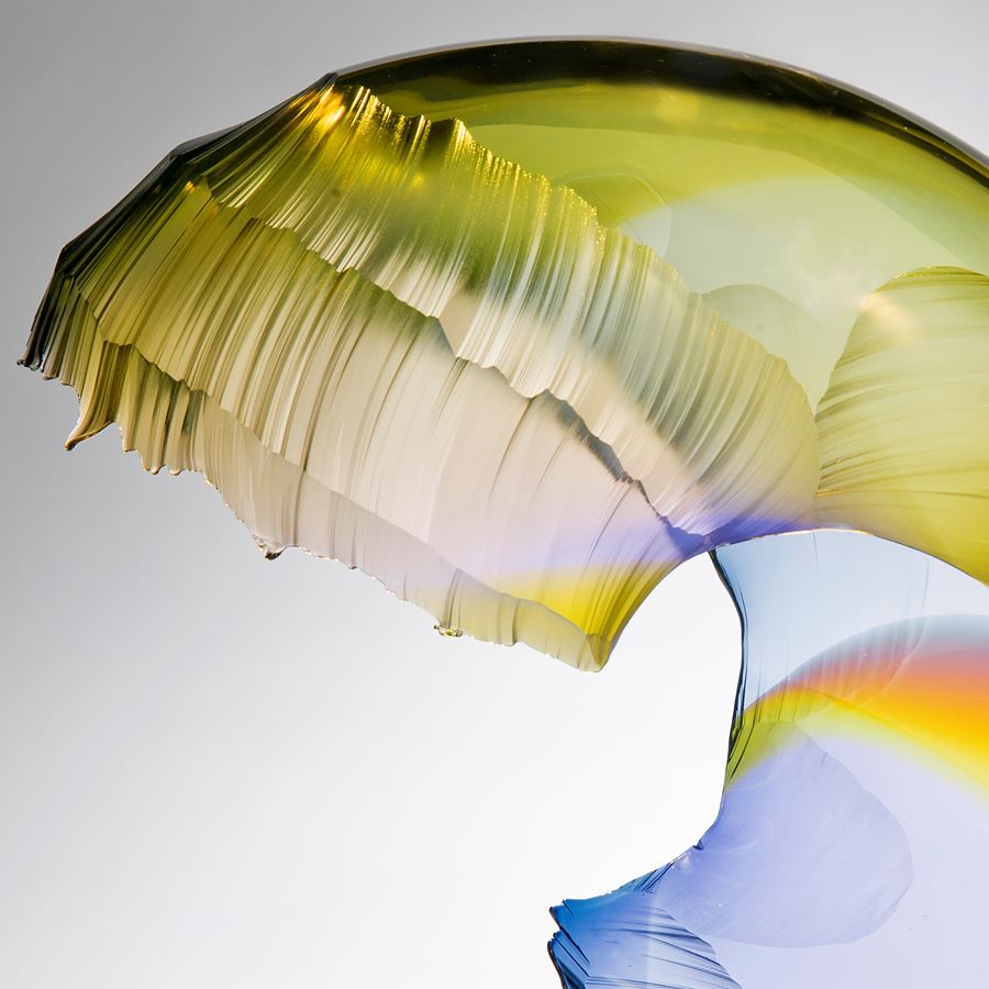 art glass wave sculpture in yellow and blue shades