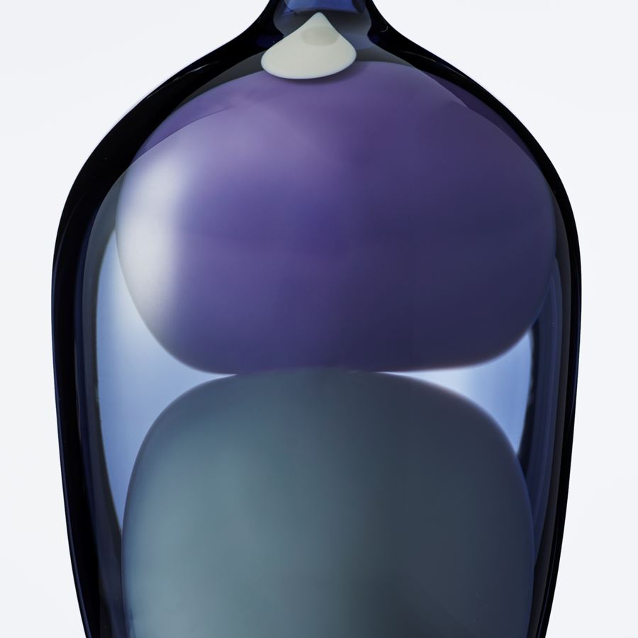blown glass vase sculpture in shades of blue purple and grey