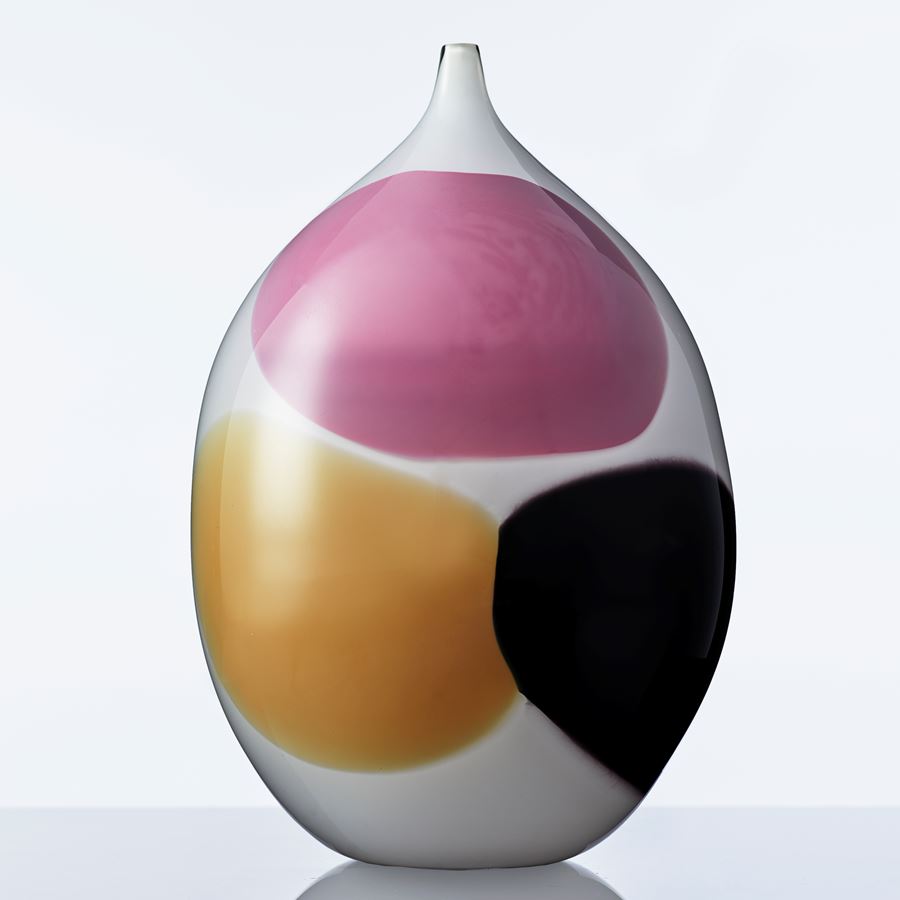 white glass vase sculpture with large pink orange and black dots