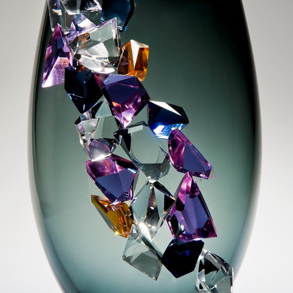 modern grey glass vase sculpture with large coloured crystal exterior
