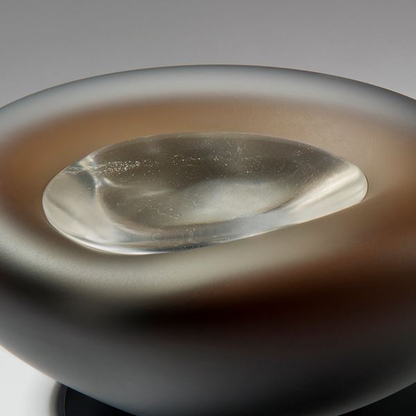 dark brown pebble shaped glass bowl with crystal like glass centre 