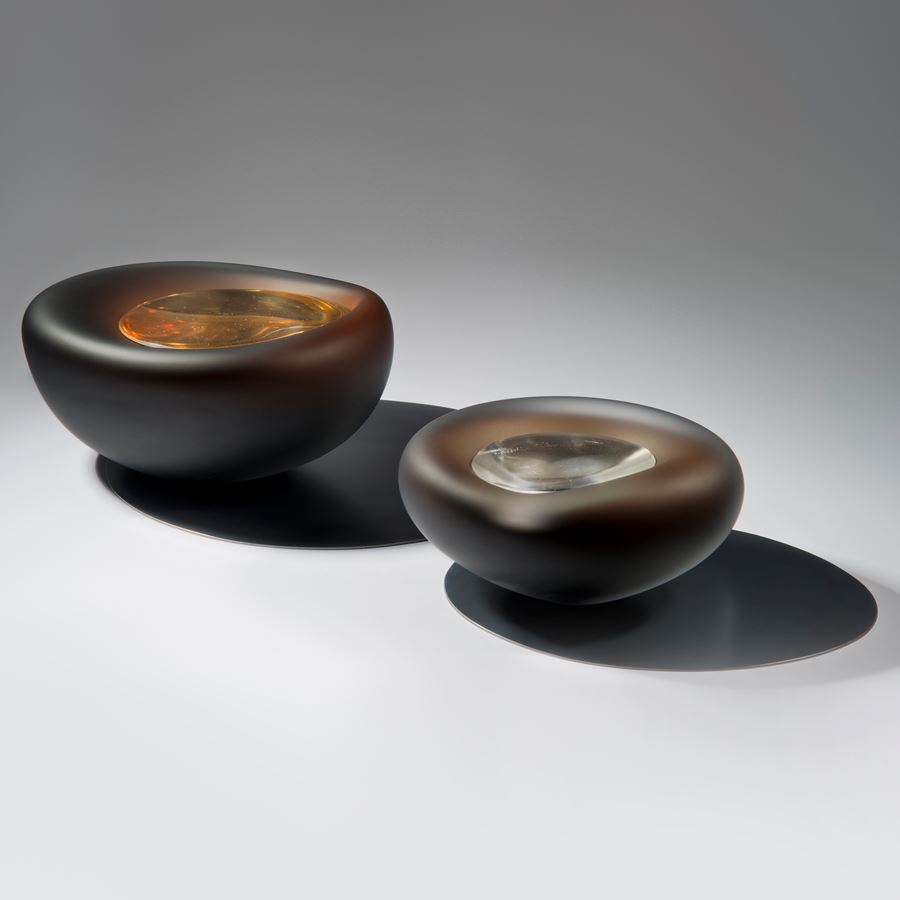 dark brown pebble shaped glass bowl with crystal like glass centre 