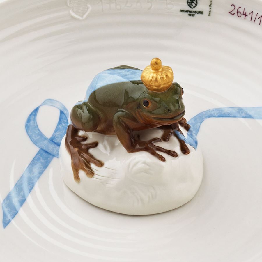 white porcelain art sculpture of bowl with miniature frog sat on top of item in the centre