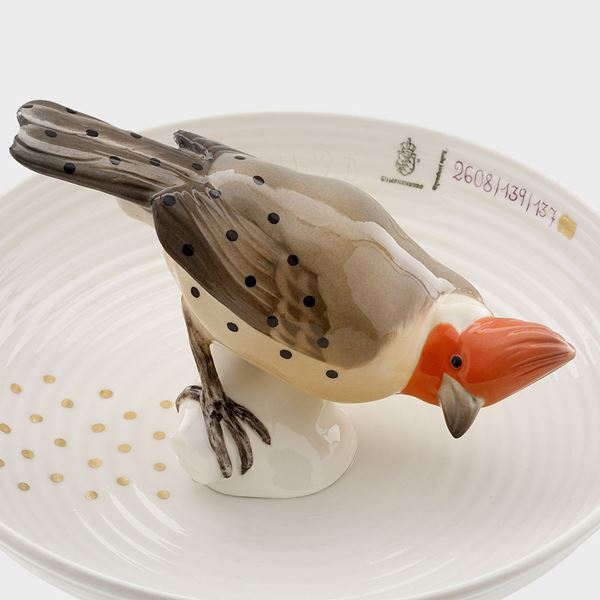porcelain decorative art bowl with model of bird sat in centre