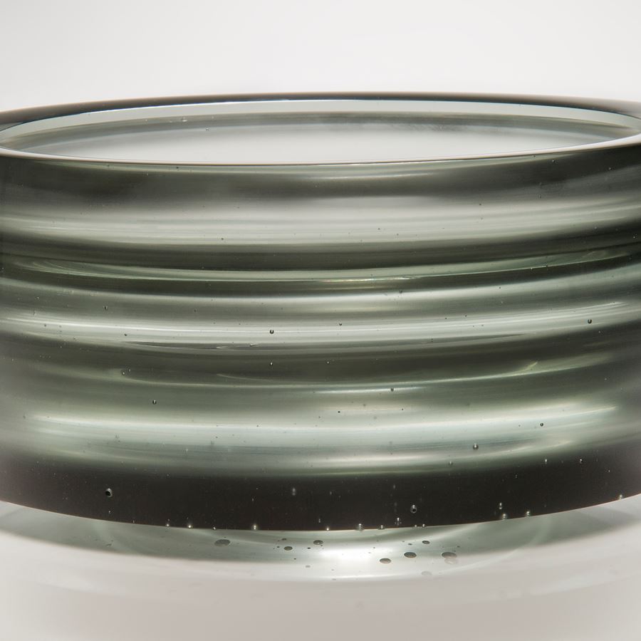 cast glass tyre-shaped sculpture in black and light grey