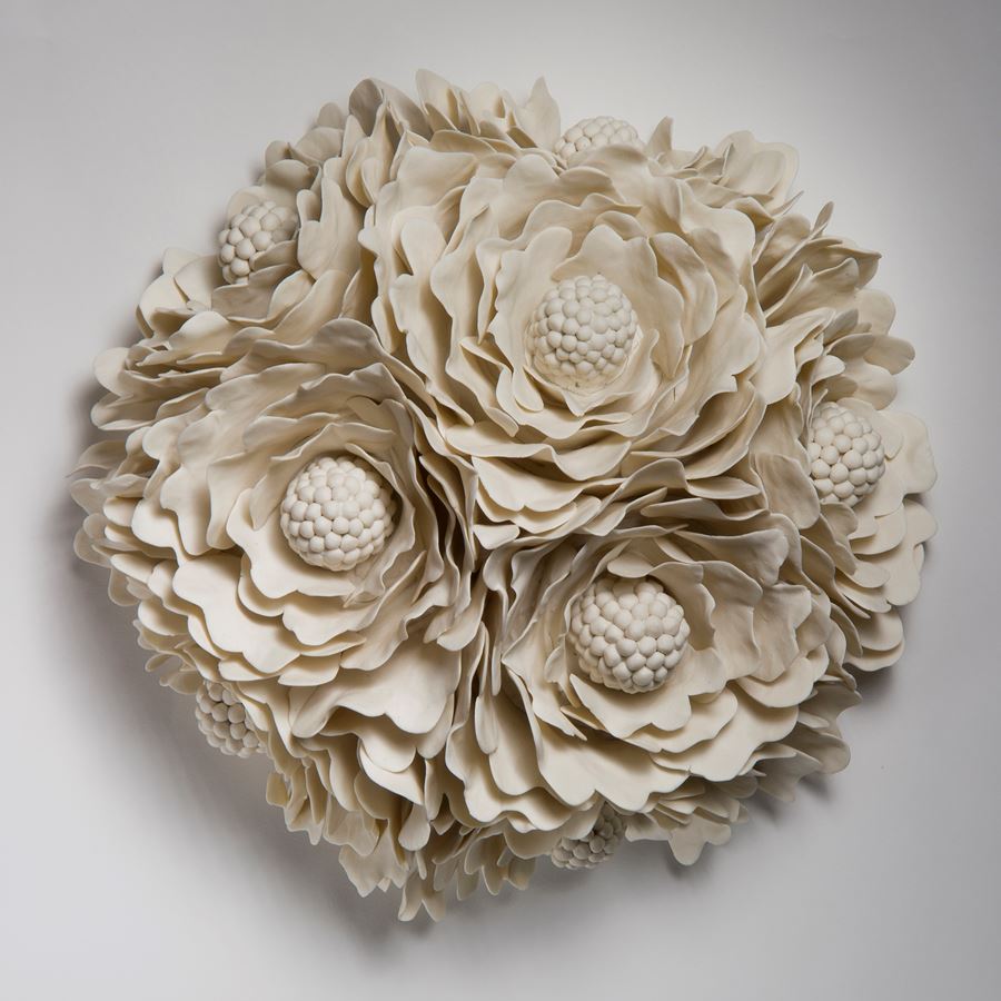 wall hanging ceramic artwork of flowers in white