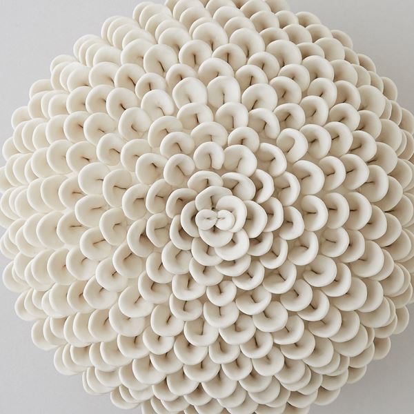 white porcelain sculpture of dahlia flowers arranged in sphere
