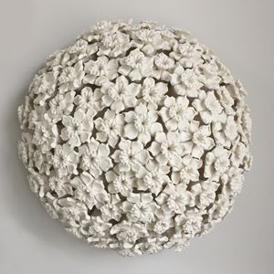 white porcelain art sculpture of daffodils arranged in sphere
