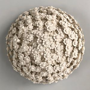 white porcelain art sculpture of daisies arranged in sphere