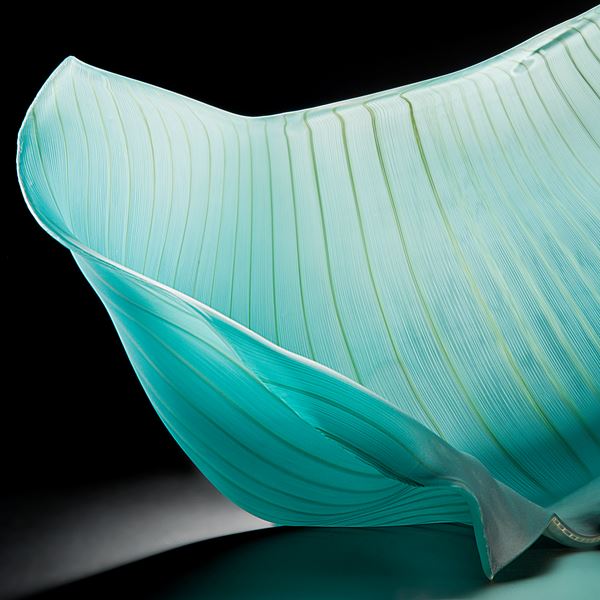 turquoise freehand blown glass sculpture of a petal