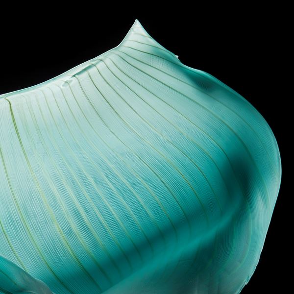 turquoise freehand blown glass sculpture of a petal
