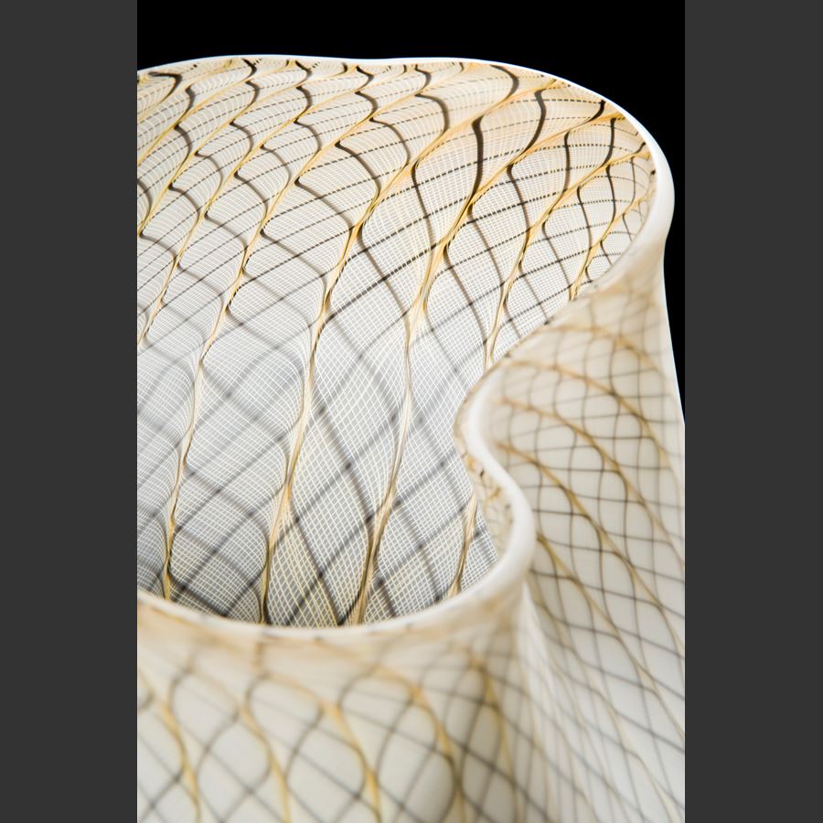 white glass art basket with faint gold pattern