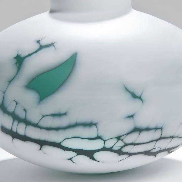 cameo glass sculpted vessel in white with faint green pattern