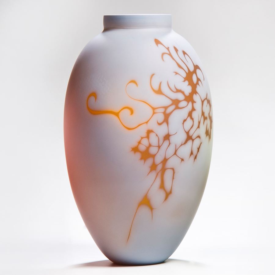 white cameo art glass vase with orange gold motif