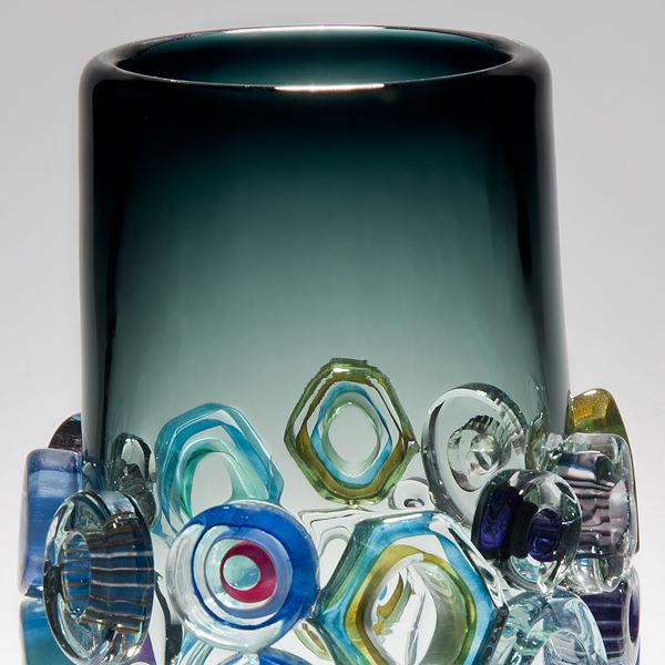 green handblown art glass vase with external adornments