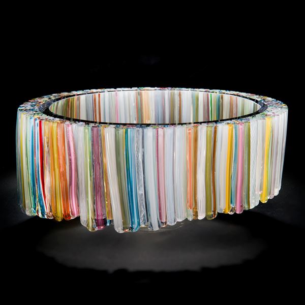 art glass sculpture of neon coloured shards arranged in hollow circle