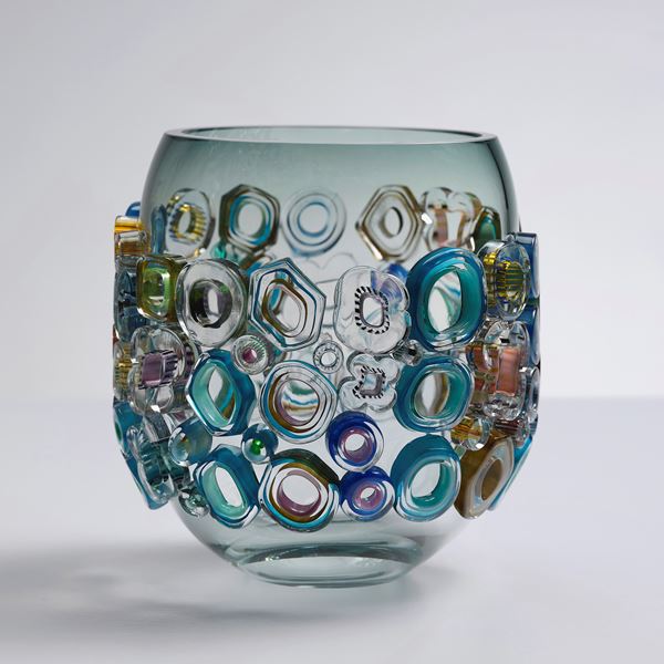 short art-glass vase sculpture in blue and green with colourful external adornments