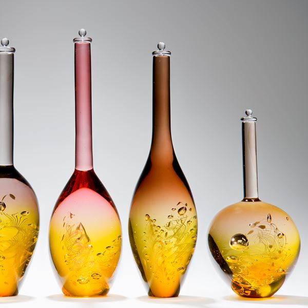 six assorted sculpted art glass bottles in amber and pastel