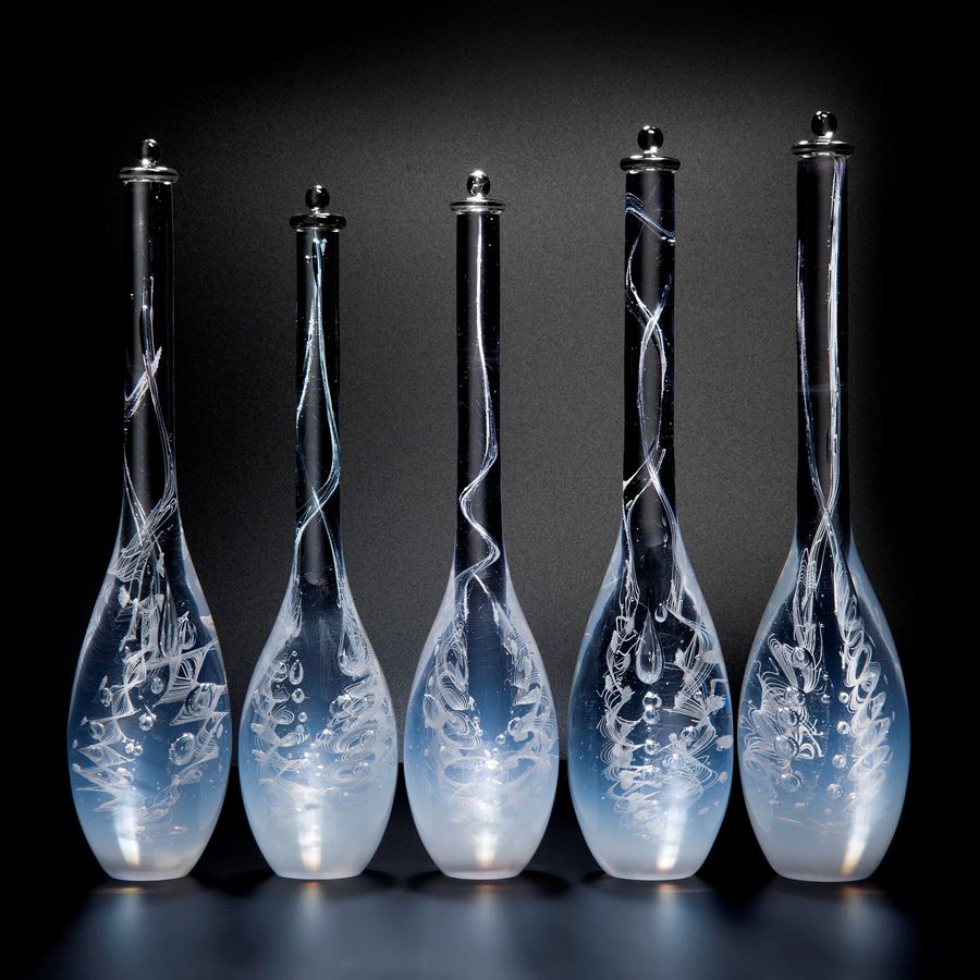 five blue art glass bottle sculptures with long necks