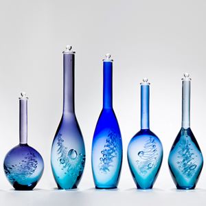 series of five blue art glass bottle sculptures