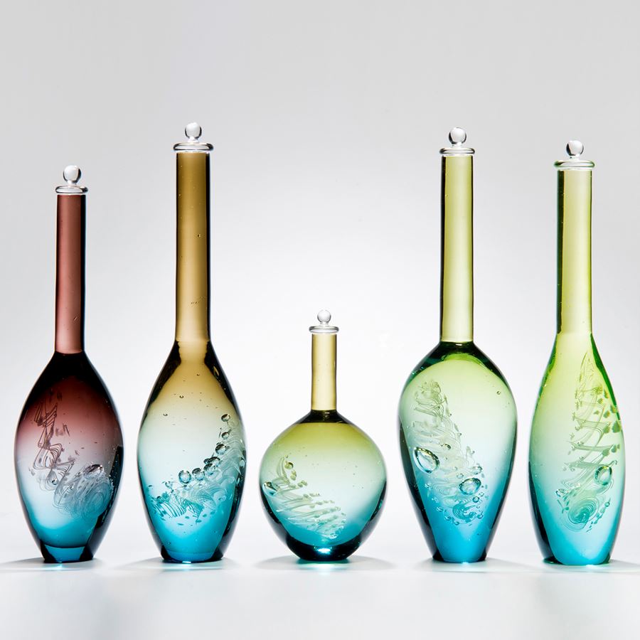 series of five blue art glass bottle sculptures