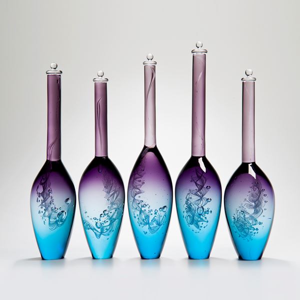 five handblown glass vase sculptures with long necks in pink purple and blue