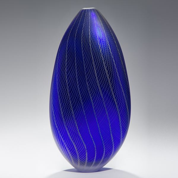 tall oval shaped dark blue vase sculpture with grey patterned exterior