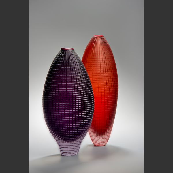 tall oblong blown glass vase sculpture in orange and red with subtle checked pattern