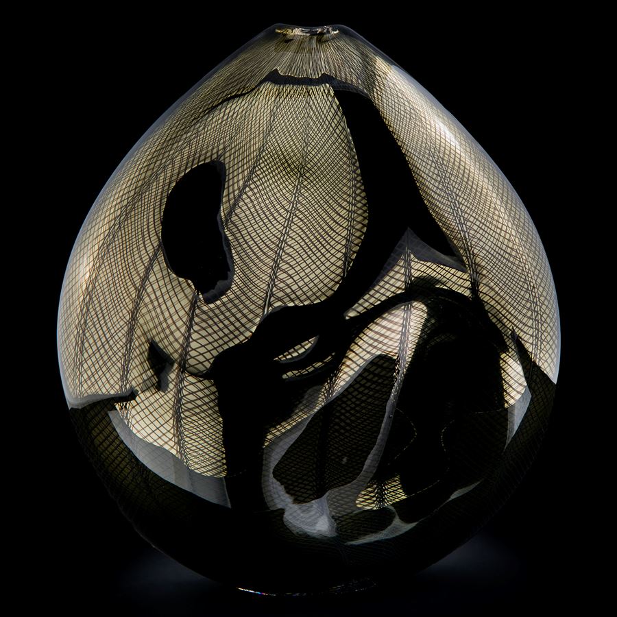 handblown minimalist glass teardrop shaped sculpted vessel in dark gold and black with wave checked external pattern