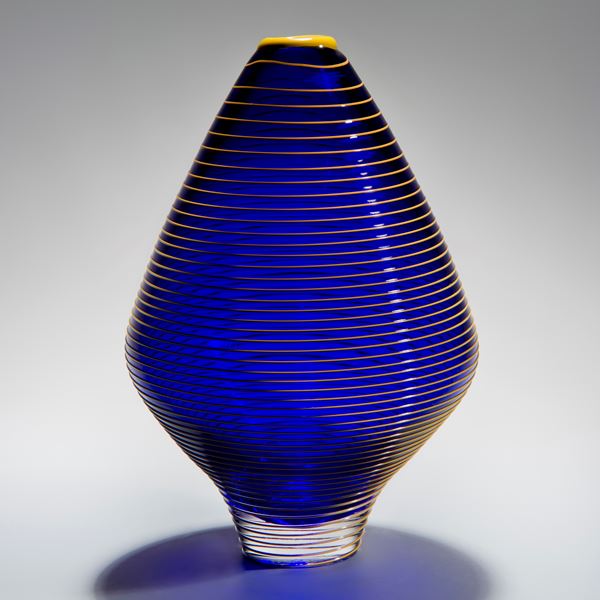 minimalist short electric blue glass  vase sculpture with faint yellow horizontal line pattern