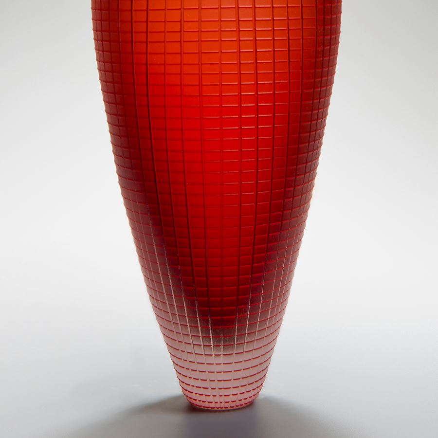 tall oblong blown glass vase sculpture in orange and red with subtle checked pattern