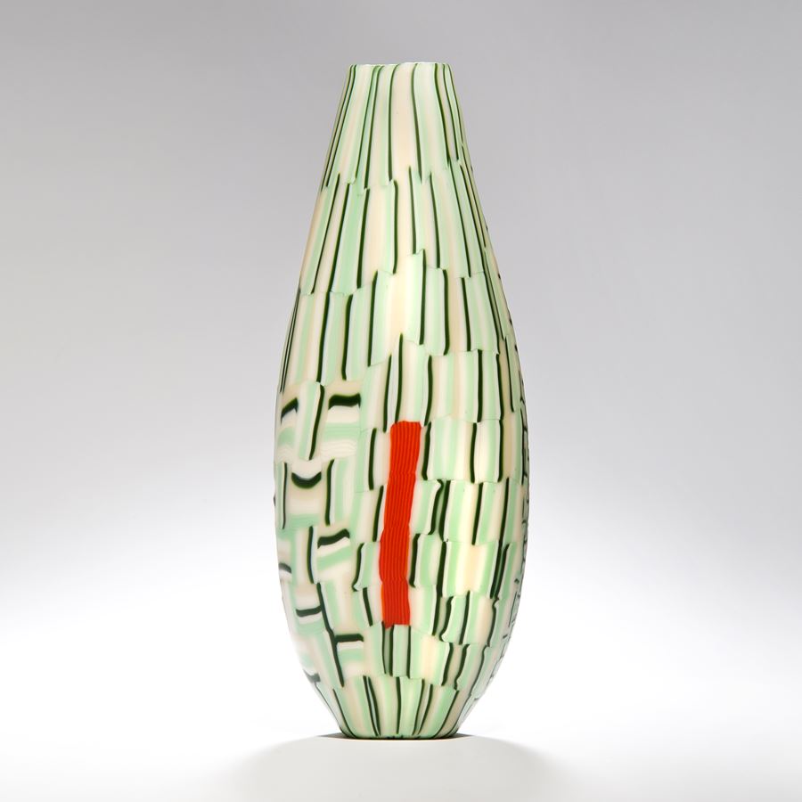 tall glass vase sculpture with off white and light green line and square patterns