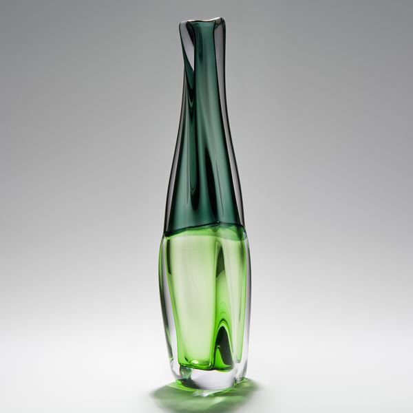 tall sculpted glass vessel in light and dark green