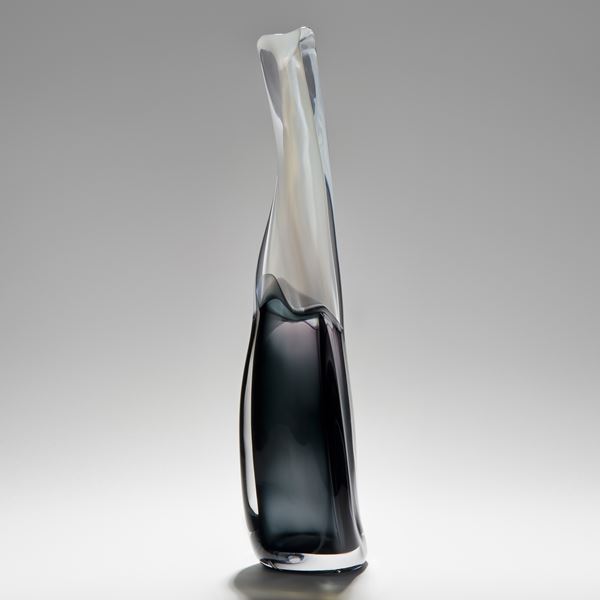 tall thin blown glass vase with black lower and clear upper halves