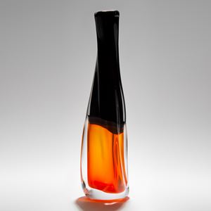 art-glass vase sculpture with bright orange bottom and black upper section