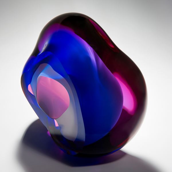 modern vug shaped abstract art glass sculpture in neon pink and dark blue