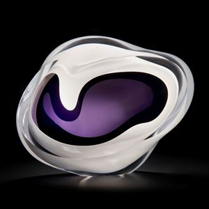 minimalist art glass sculpture of a rock in white with purple and black centre