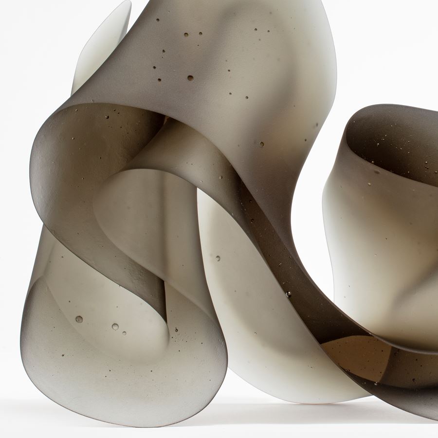 contemporary abstract art-glass scultpture of squiggly line in grey and white