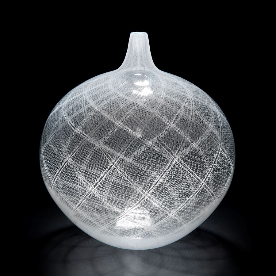 round blown glass vase with intricate white cane pattern