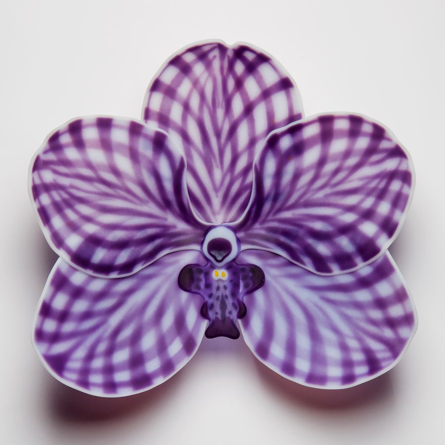 hand made fused glass sculpture for wall mounting of viola flower in chequered white and purple