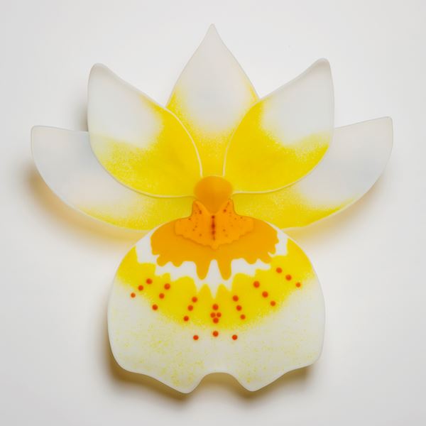 glass sculpture of pansy flower in yellow and white