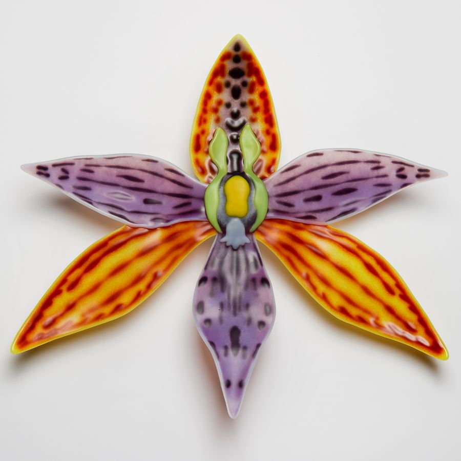 colourful glass art sculpture of flower in star shape