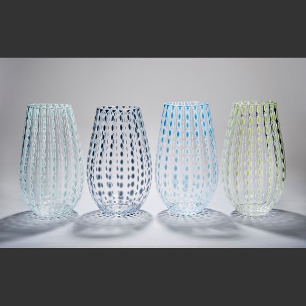 selection of clear melon shaped vases in various spotted colours