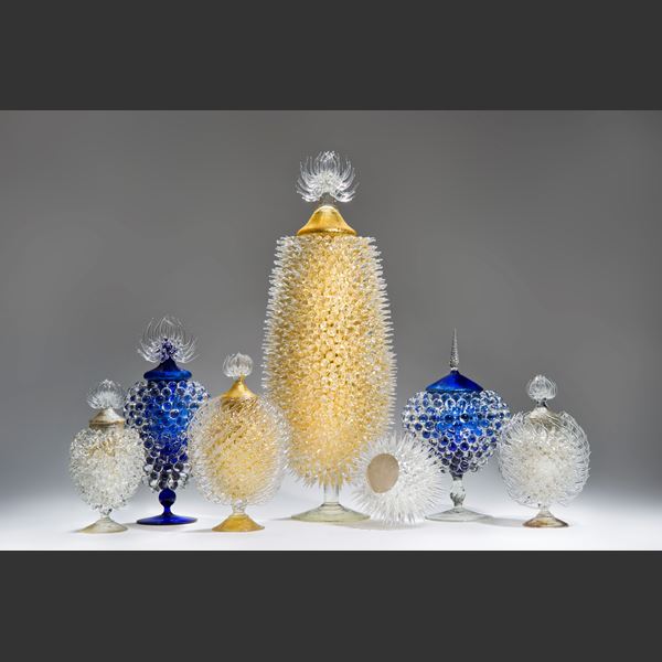 whiite glass sculpture of prickly centred jar with steel gilding 