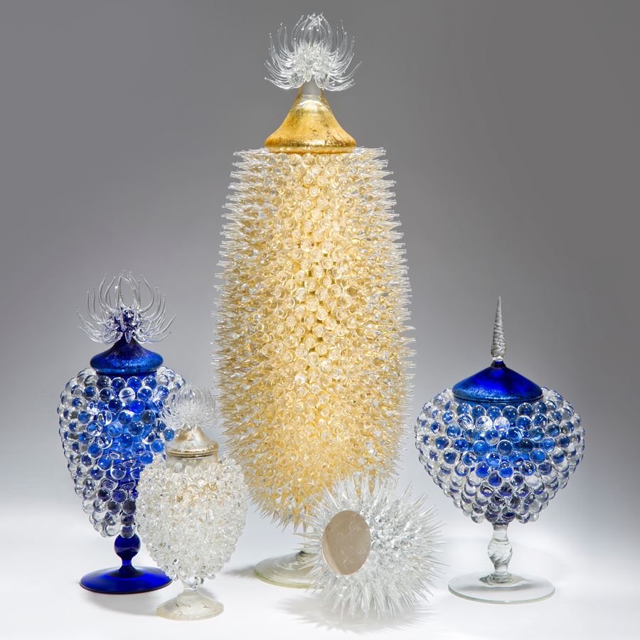 art glass sculpture of urchin in white with gold centre