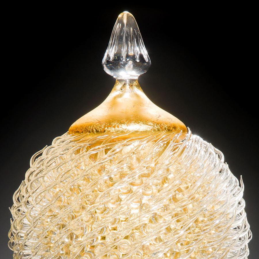 tall art glass jar sculpture with long base and gold thistle body